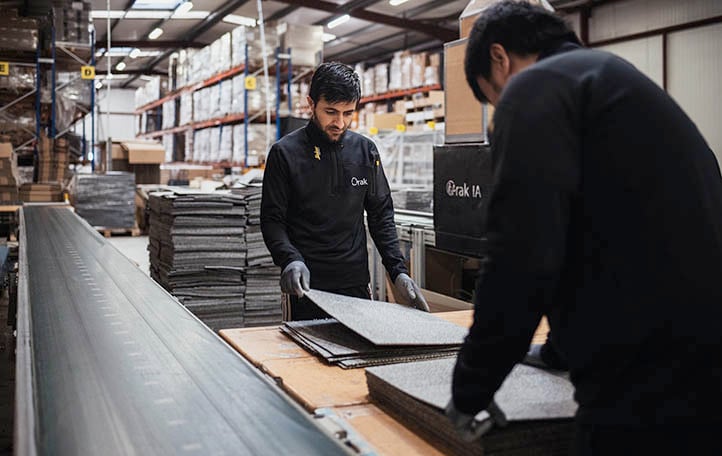 Orak employees sorting carpet tiles