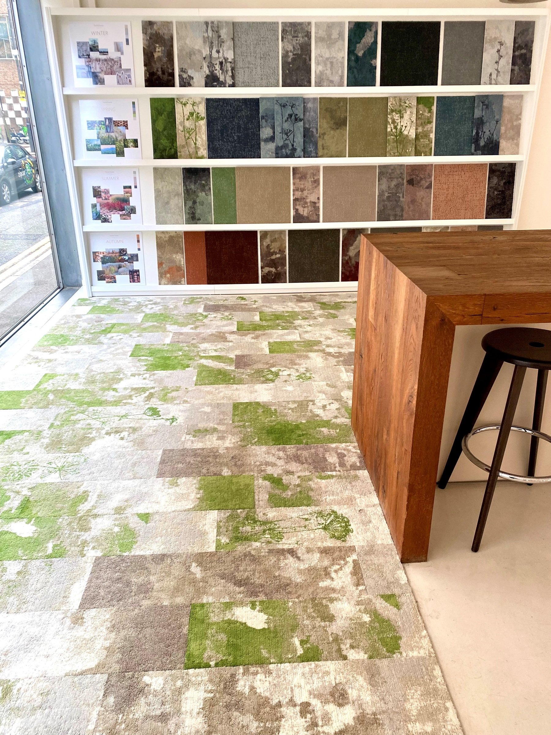 Milliken's London showroom with coloured carpet tiles with nature motifs